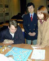 British univ. welcomes Japanese shogi players